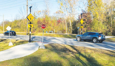  This shows an example of an upgraded mid-block crossing with a Rectangular Red Flashing Beacon, or RRFB, located on 19 Mile Road and Flis Drive that connects subdivisions and a nature park in Sterling Heights. 