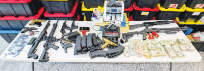 Nearly 1,000 pounds of black-market marijuana, weapons and more was seized from a home in Shelby Township. 