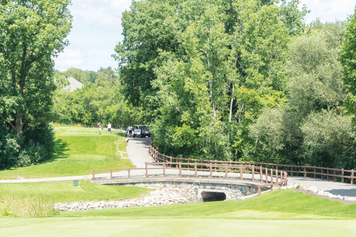  Golfers tee off at Glen Oaks golf course. 