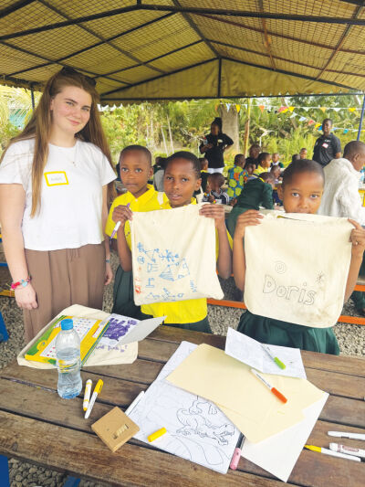  While in Tanzania, Annie Minor provided materials and ran craft stations. One of them involved making a canvas bag craft for each child to take home.  