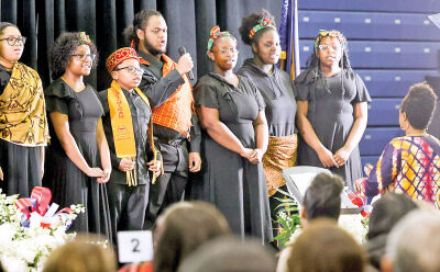  The University K-12 Academy Choir performs a song. 