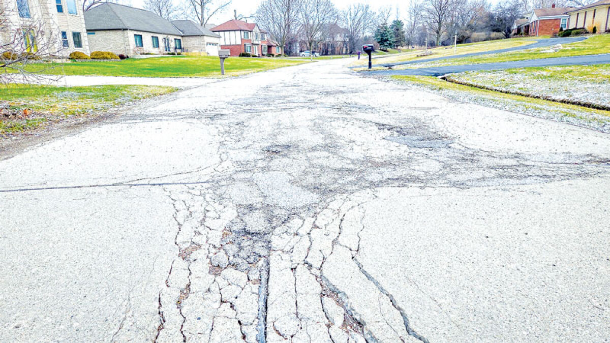  A stretch of Rainbow Circle on March 17 in Lathrup Village shows the trouble with the pavement that has the residential road scheduled for reconstruction. 