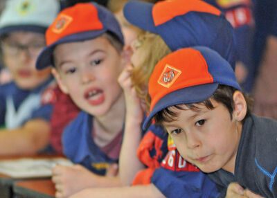 Scouts watch as the cars go by.