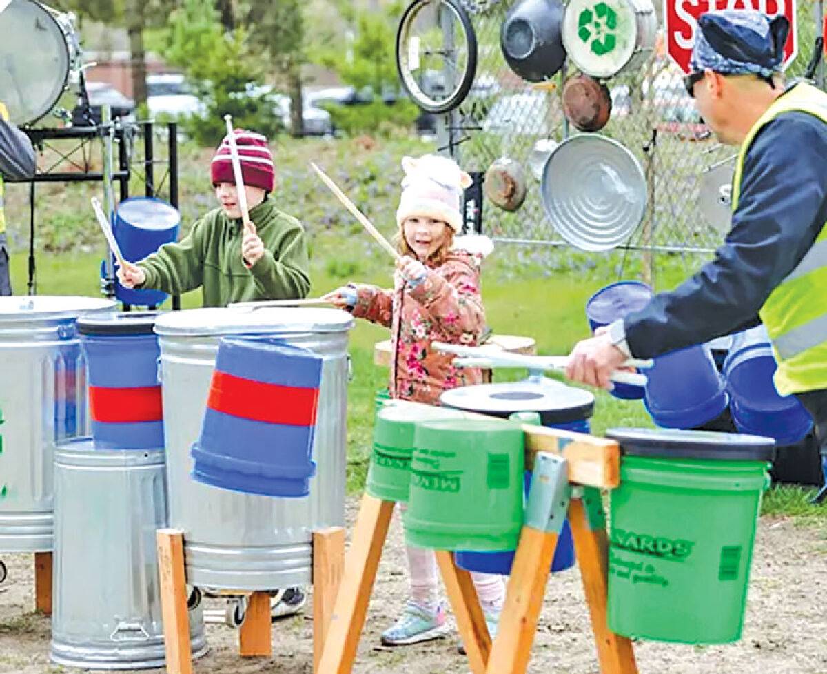  Kids play upcycled instruments at a past Detroit Zoo Greenfest. 