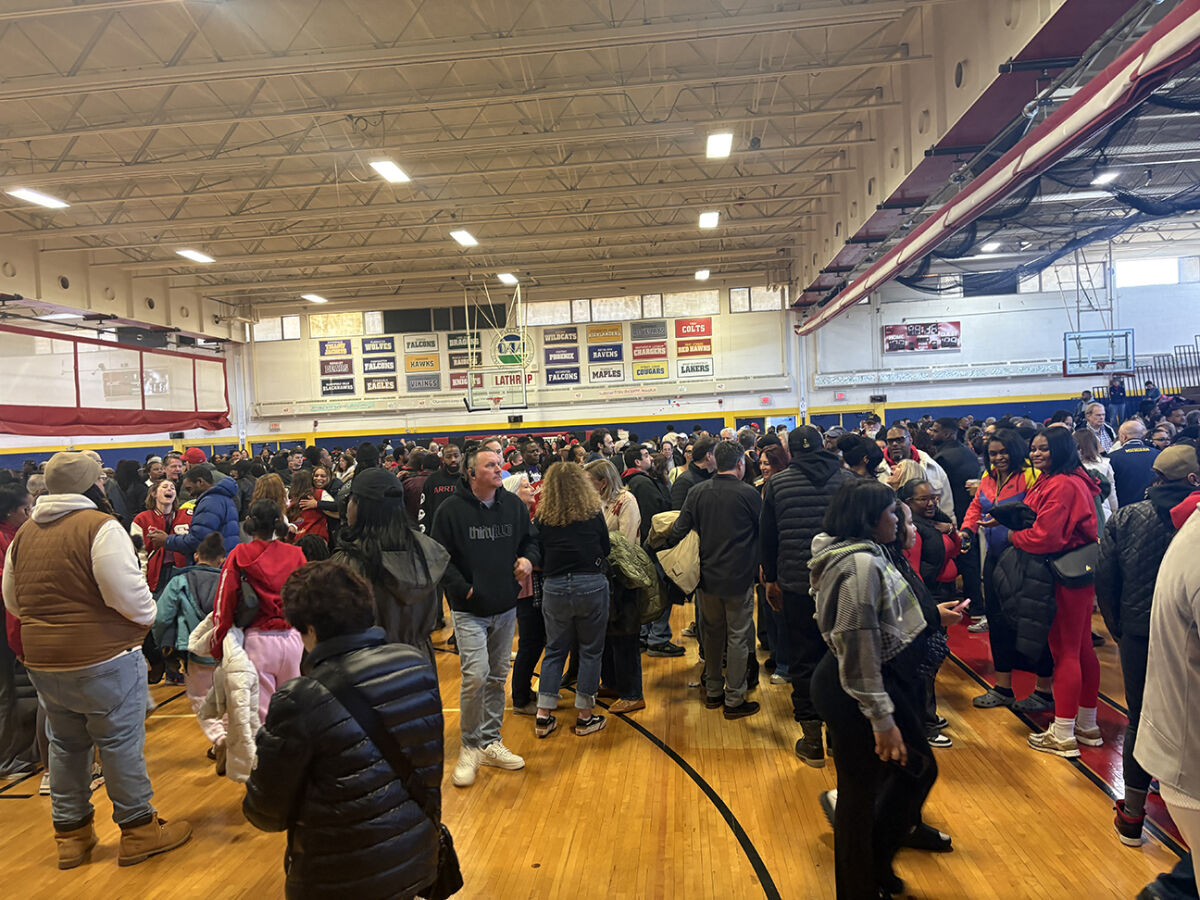  Alumni from Southfield Lathrup High School gather in the gymnasium of University K-12 Academy on March 28. Southfield Public Schools held a final farewell event for the University K-12 Academy, formerly Southfield Lathrup High School, as the district will begin reconstruction of the campus in the summer. 