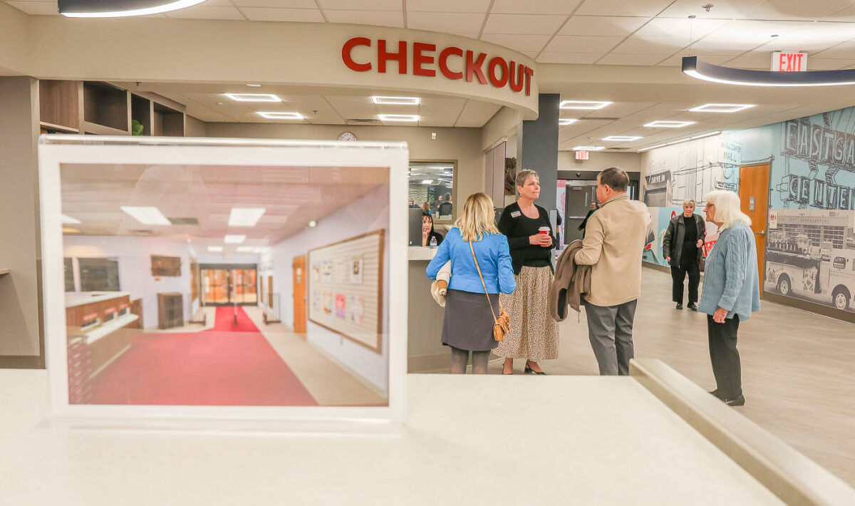  Placards featuring photos of the pre-renovation library are scattered throughout the facility during the sneak peek March 28. 