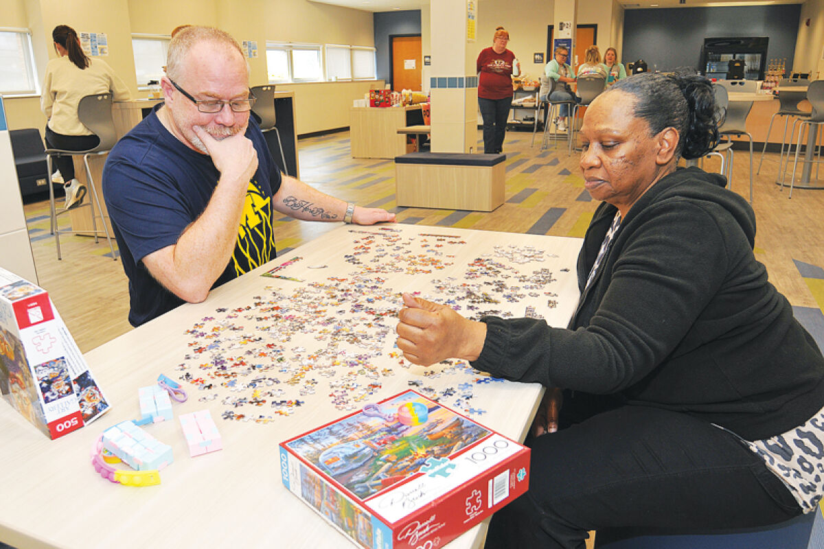  Ed Iciek and Carmelia Ferrel work together on a 500-piece jigsaw puzzle. That was a popular activity. 