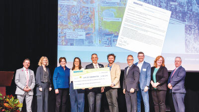  The Southeast Michigan Council of Governments presented the city of Farmington with a check for nearly $500,000 at the event. The funding will pay for new sidewalks and crosswalk improvements throughout the city. 