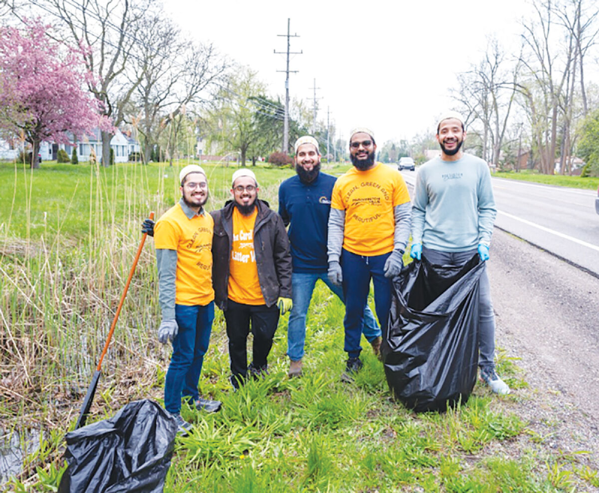  Members of the community gather at a previous Carol Posey Litter Walk to pick up debris along the main  roads of Farmington Hills. This year’s cleanup event will take place April 25. 