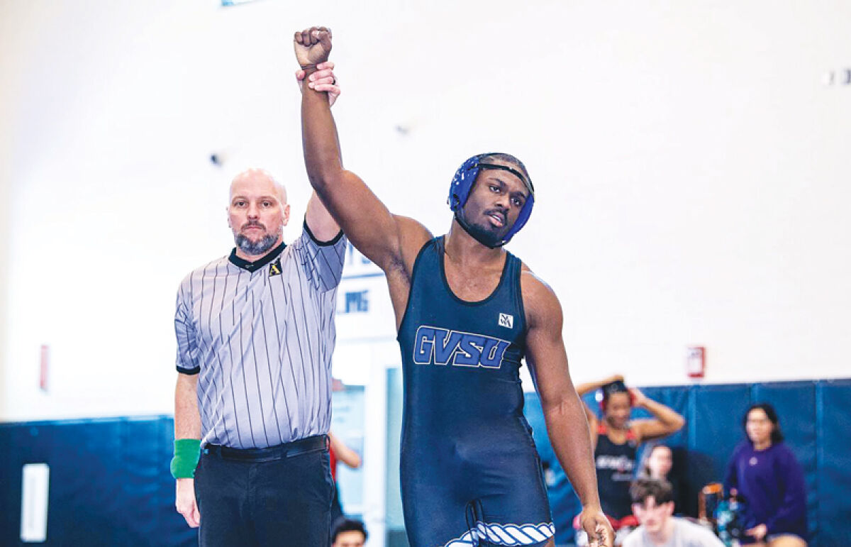  Artero Wilson gets his hand raised after a win at the 2026 NCWA National Championships in Louisiana on March 27. 