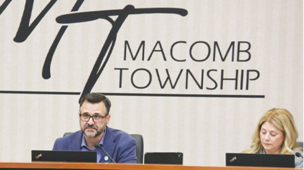  Macomb Township Supervisor Frank Viviano, flanked by Treasurer Leon Drolet to his left and Clerk Kristi Pozzi to his right, speaks about the township’s cross-connection inspection agreement with HydroCorp at the March 25 Macomb Township Board of Trustees meeting. 