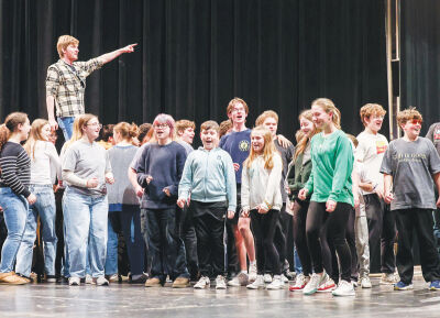  Choreographer Andrew Pankiewicz works with the “Les Misérables” cast, which includes several middle school students. 