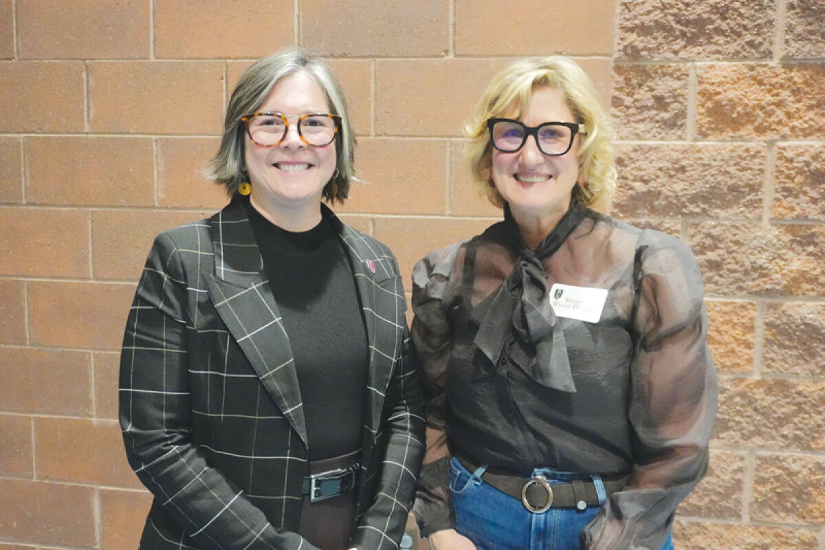  Rochester Community Schools Board of Education President Barbara Anness and new trustee Sherry Wynn Perdue pose for a photo. 