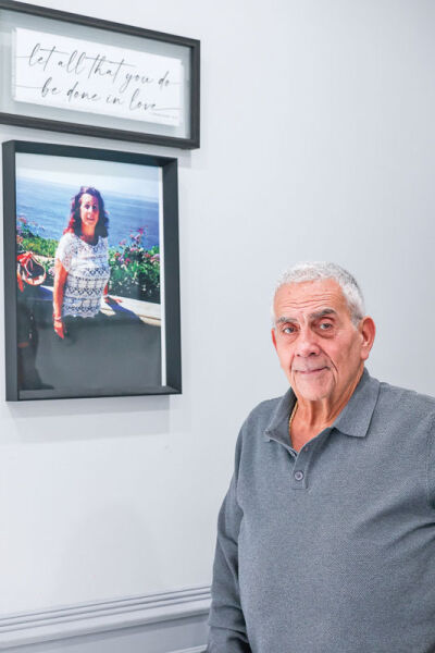  James Nahra, owner of Lakeland Manor, stands near a photo of his wife, Sandra, who created many of the recipes for the banquet center. 
