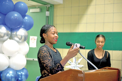  Eighth graders Elizabeth White, left, and Neveah Harris, right, were able to speak about their memories of the school. 