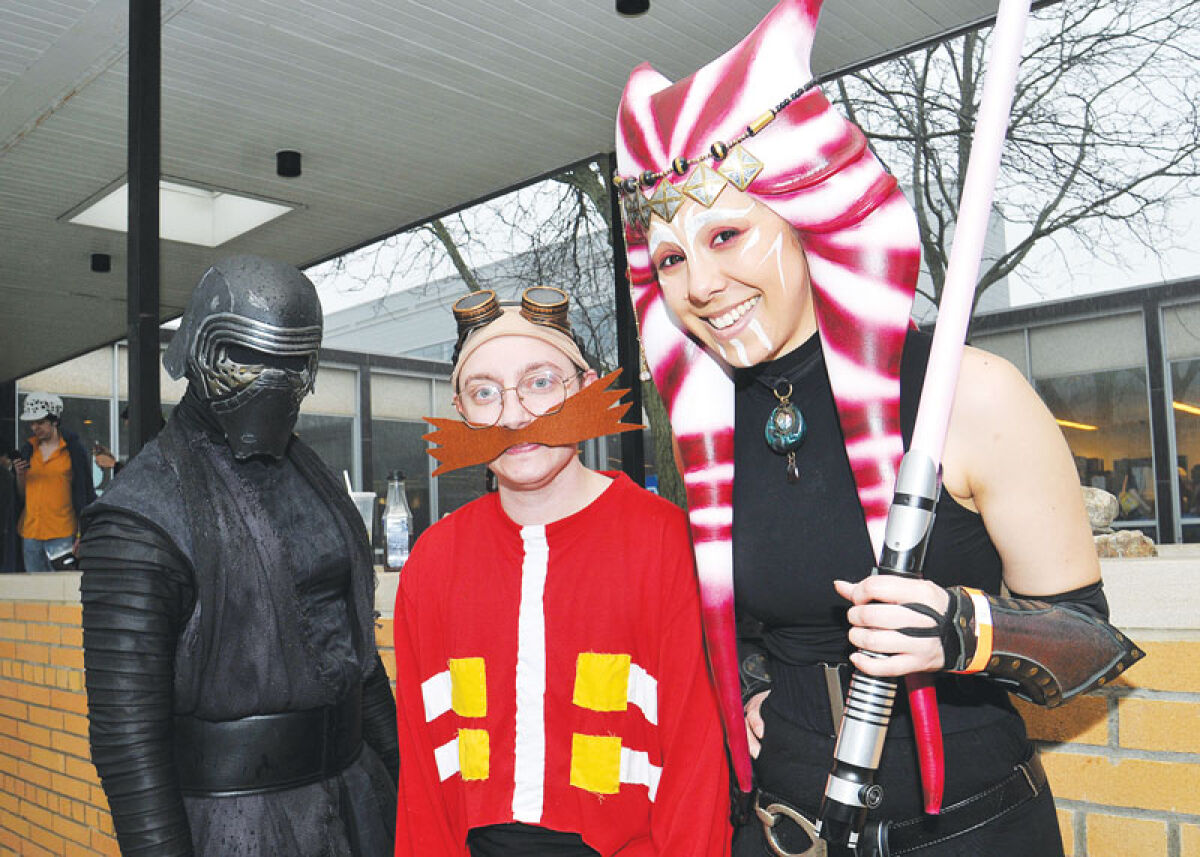  Star Wars character Kylo-Ren, left, joins Makenna Alvira, right, who wears an original “Star Wars” costume that she designed at LTUX April 4. With them is Kaiden Ember, who portrays Doctor Eggman from the Sonic the Hedgehog franchise. 