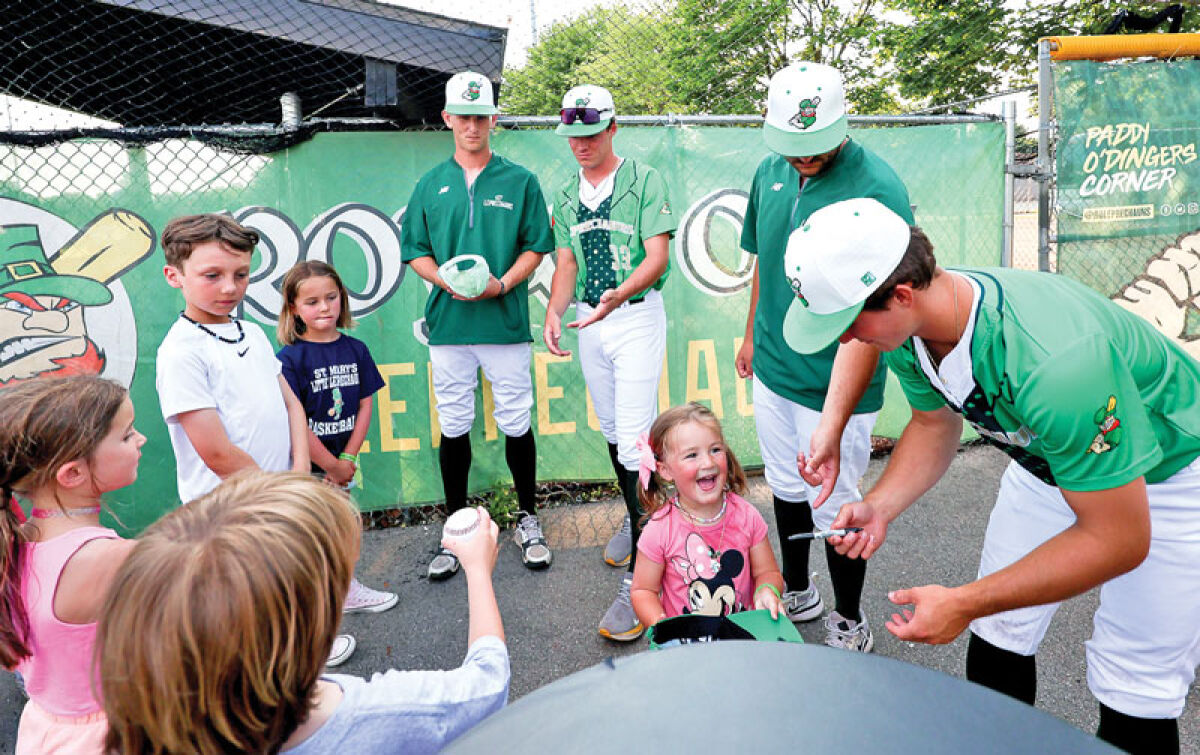  Royal Oak Leprechauns players meet young fans at a July 2 game against the Traverse City Pit Spitters at Memorial Park. The Leprechauns used this game to raise money to fight cancer. 