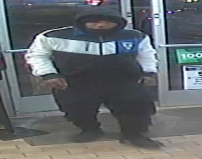  Police said this surveillance camera footage taken on Jan. 13 from a 7-Eleven store in Madison Heights shows suspect Derrick Hughes moments before he robbed the store at gunpoint. 