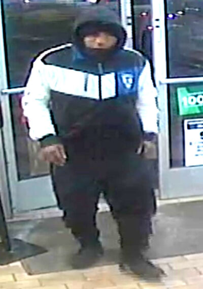  Police said this surveillance camera footage taken on Jan. 13 from a 7-Eleven store in Madison Heights shows suspect Derrick Hughes moments before he robbed the store at gunpoint. 