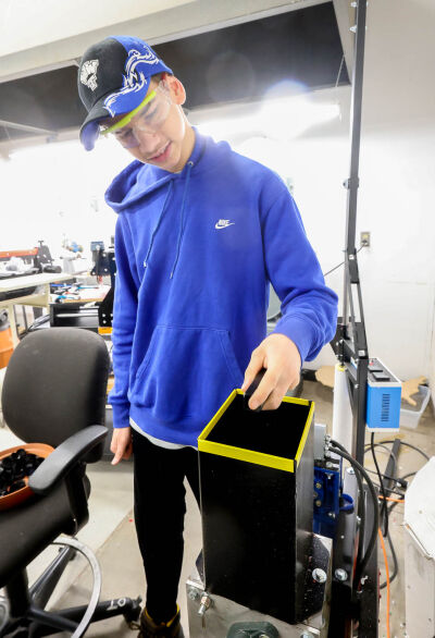  Warren Woods Tower High School student Austin Korte, 18, works on the granulator in class April 2. 