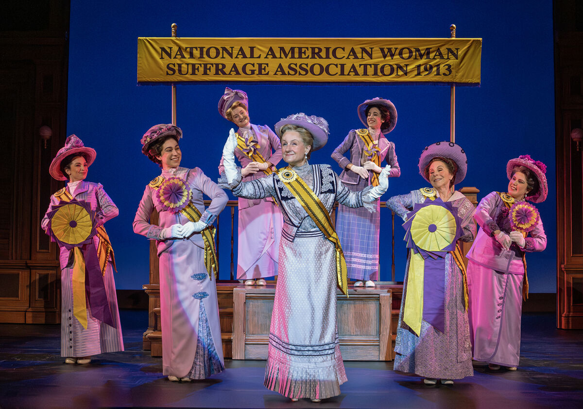  Marya Grandy — as Carrie Chapman Catt — and company appear in a scene from in the first national touring company of “Suffs.” 