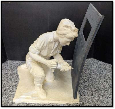  This model shows what the completed Rosie the Riveter statue will look like with the bomber panel added to it. 