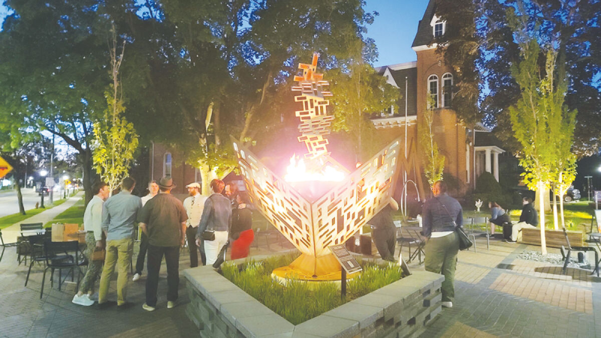  The Unity Torch burns brightly at Masons Corner, a popular gathering space for the community. The art pays homage to the enduring spirit of the community.  