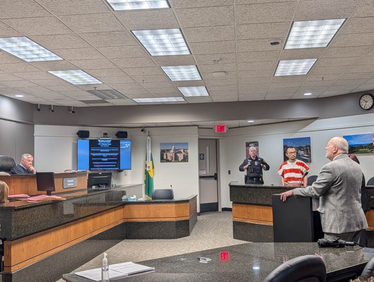  Judge David Law, of the 52-1 District Court in Novi, listens as attorney Joseph Xuereb addresses the court in defense of alleged ambulance hijacker Changlin Li, of Novi, who is looking on in the background. 