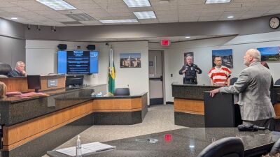  Judge David Law, of the 52-1 District Court in Novi, listens as attorney Joseph Xuereb addresses the court in defense of alleged ambulance hijacker Changlin Li, of Novi, who is looking on in the background. 
