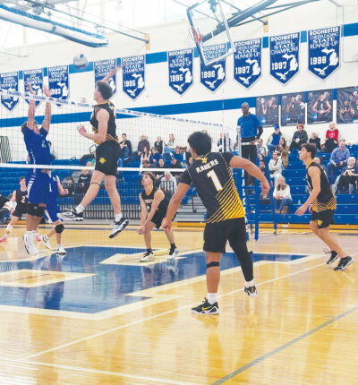  North Farmington sets up a spike against Rochester High School on April 7. 