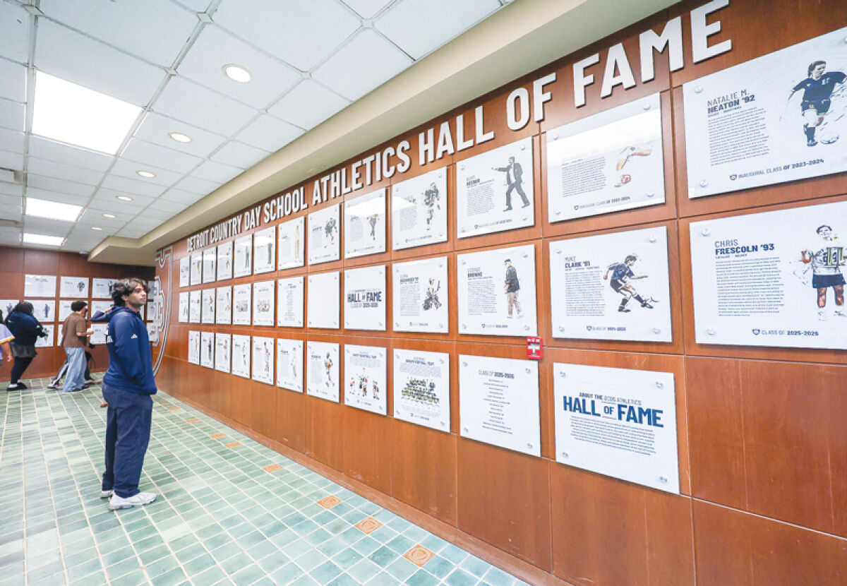  Students walk through the Detroit Country Day School Hall of Fame. 