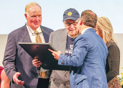  Neil Brown is presented with the  DCDS men’s basketball team Hall of Fame honor April 10 at Detroit Country Day  School high school. 