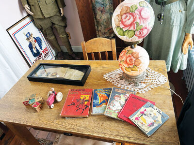  Historic toys and books are shown on display. 