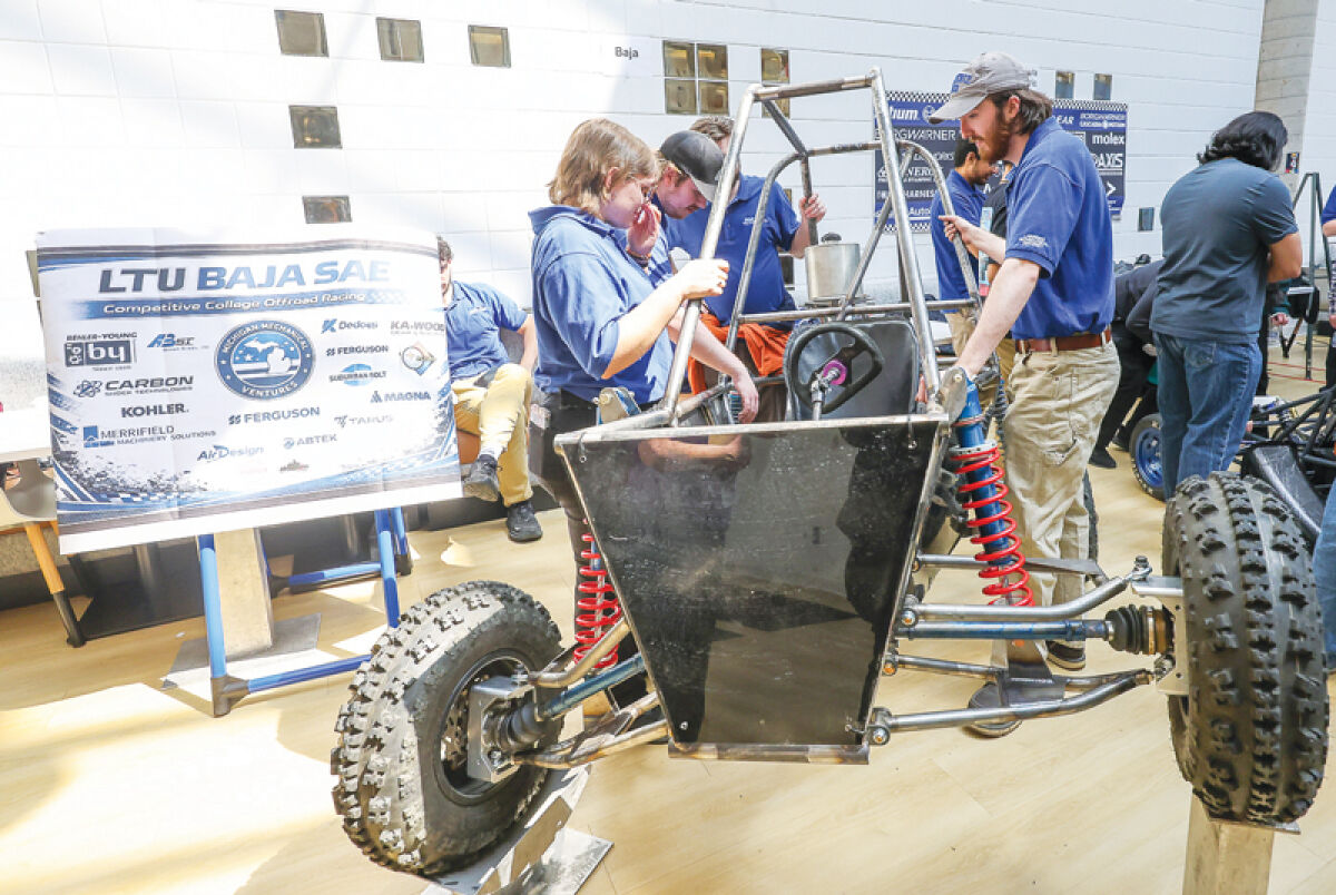  The Baja SAE team at Lawrence Technological University in Southfield unveils its vehicle April 7 at the Buell Building. 
