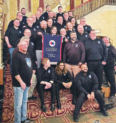  The Five Lakes Silver Band holds its championship banner at the 2026 North American Brass Band Championships. Since this win, the band has been invited to the 2026 World Music Contest. 