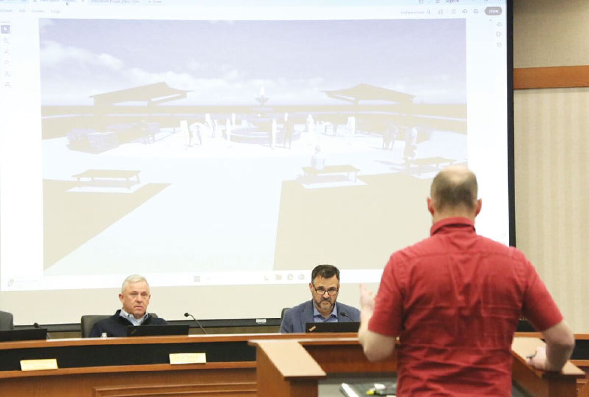  Kevin Johnson, director of Macomb Township Department of Public Works, speaks to the Macomb Township Board of Trustees on April 8 about the purchase of parts for a splash pad and fountain to be built outside of the Township Hall. 