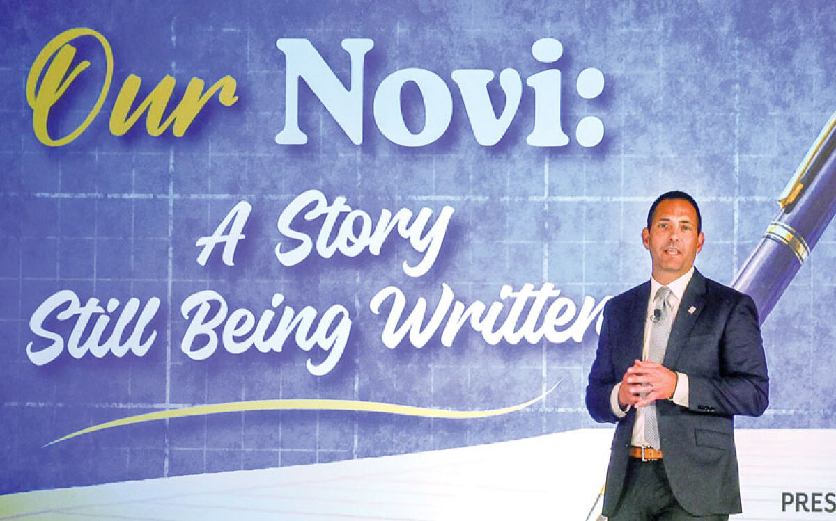  Novi Mayor Justin Fischer presents the annual State of the City address April 17 using a book theme at the Sheraton Detroit Novi Hotel. 