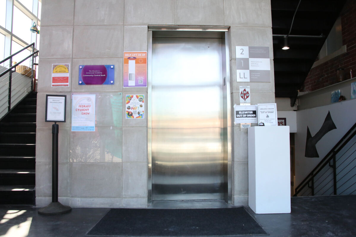  From the foyer of the Anton Art Center, the elevator shaft is flanked by staircases. The inoperable elevator means people with mobility issues cannot access the Art Center’s galleries, offices, classrooms and bathrooms. 