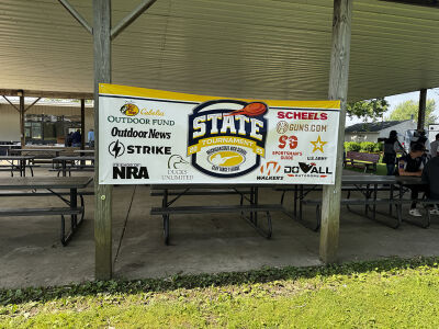  A 2025 Michigan High School Clay Target League state tournament sign hangs in Mason, Michigan. 