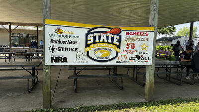  A 2025 Michigan High School Clay Target League state tournament sign hangs in Mason, Michigan. 