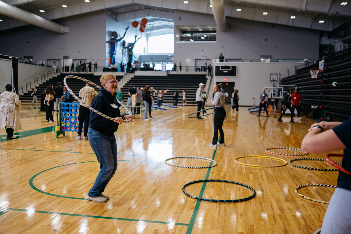  Attendees of the Unite to Ignite Summit participate in some of the interactive activities available at the Wayne State Fieldhouse on April 24. 