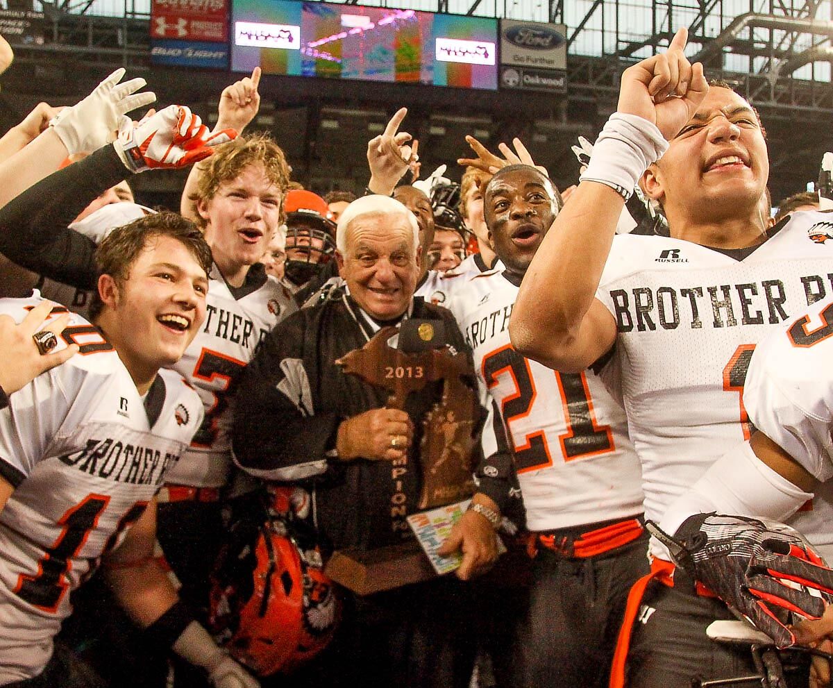  Al Fracassa celebrates at Ford Field after winning the 2013 state championship. It was his final game. 
