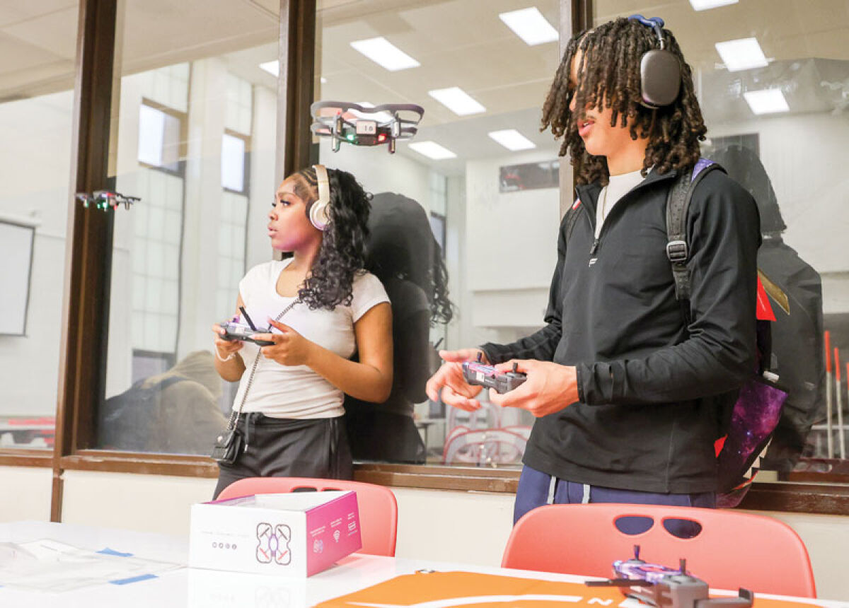  Roseville High School sophomores Aryelle Harris and Kyle Chase prepare to fly the CoDrone EDU in class April 28. 
