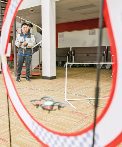  Junior Jimmy Chau practices on the obstacle course. 