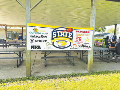  A 2025 Michigan High School Clay Target League state tournament sign hangs in Mason, Michigan. 