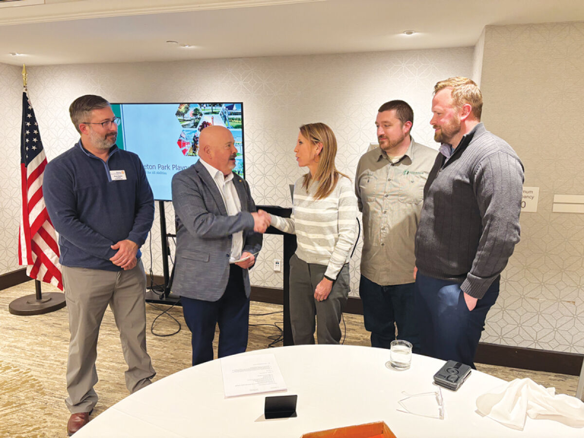 The Birmingham Rotary Club presented a check to the Birmingham Parks Department. From the left are Ryan Quinn, Joe Bauman, Carrie Laird, Brad McNab and Scott Zielinski.  