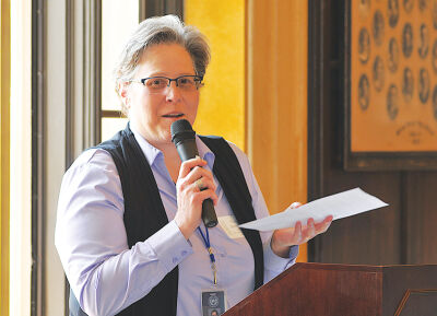 Grosse Pointe South High School Principal Cindy Parravano welcomes attendees to Cleminson Hall. 