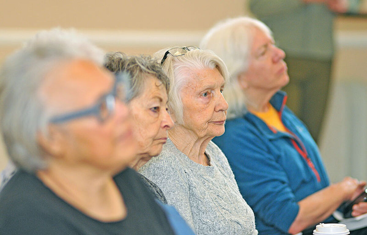  Attendees at a fraud awareness workshop in Lathrup Village listen carefully to catch every detail on how to avoid financial fraud and scams. The workshop, which took place on April 29, was organized by the Lathrup Village Police Department, in partnership with the Lathrup Village Downtown Development Authority and Chase Bank. 