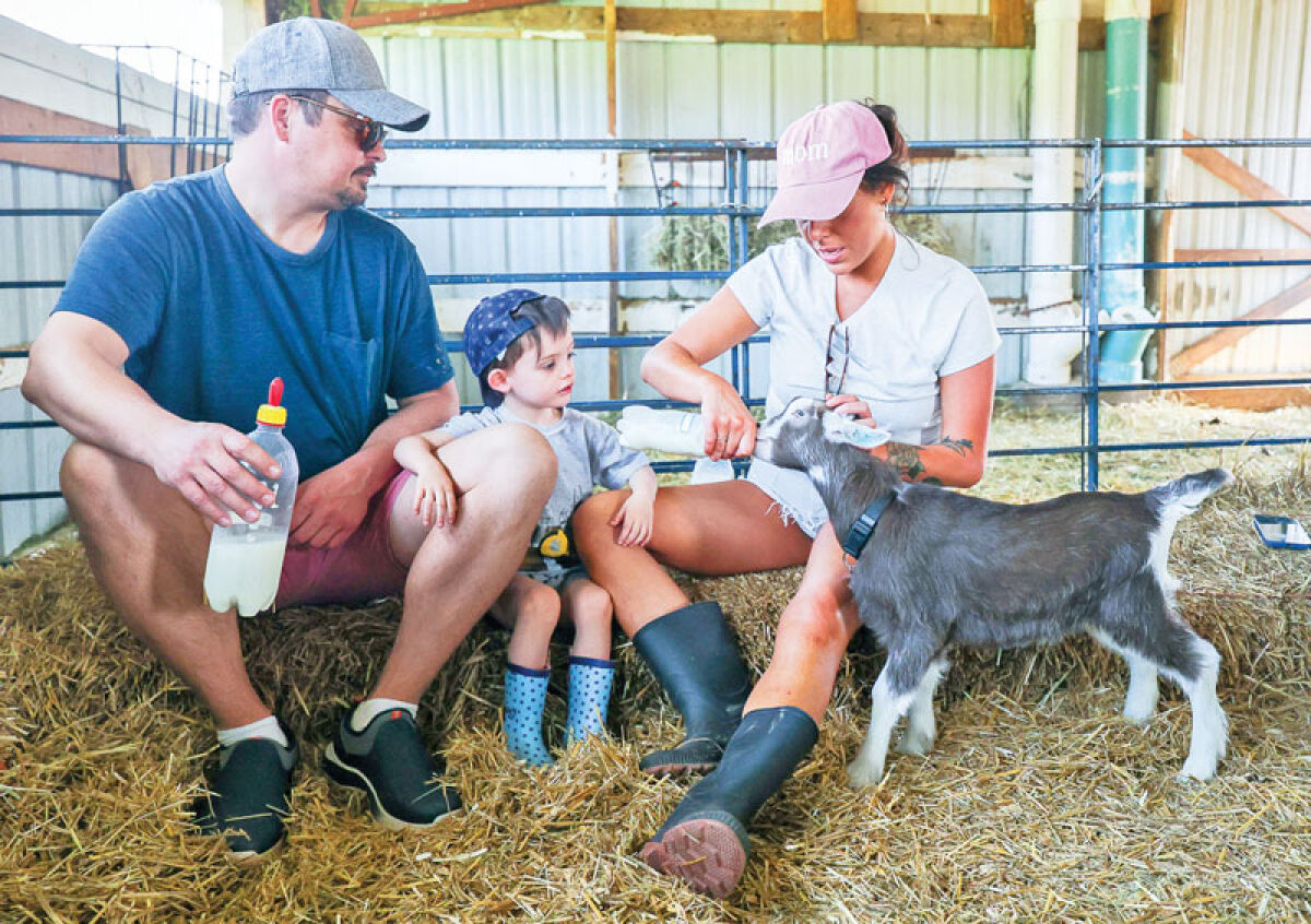  Tim and Marisa Hillebrand, of Livonia, feed the kids April 22 with their son, Nicky, 3. 
