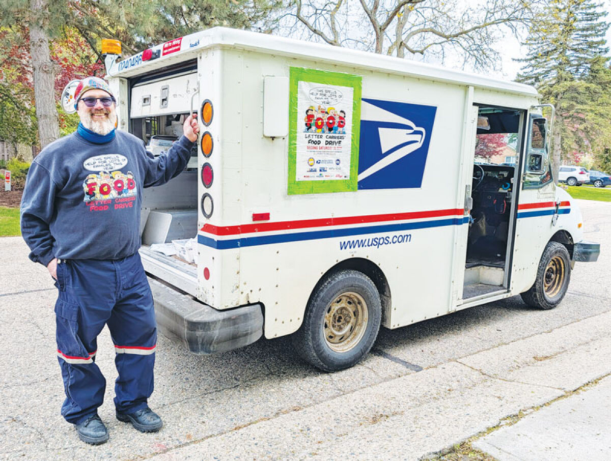  Letter carrier Kevin “Ohio” Walker is ready to participate in the annual letter carrier food drive. 
